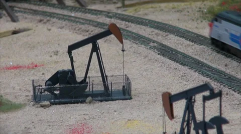 Model Train - Oil Pump while Train is Passing Stock Footage 39504404
