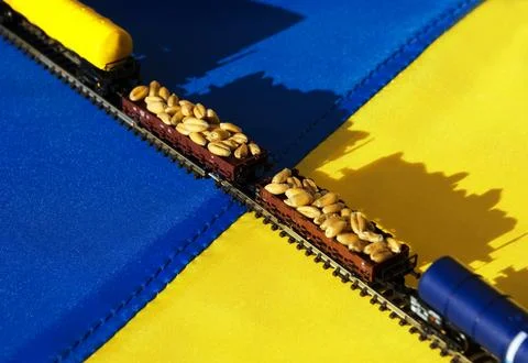Model train on the Ukrainian flag. Stock Photos