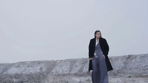 Model in trendy outfit posing outdoors in the snow Stock Footage 72916111