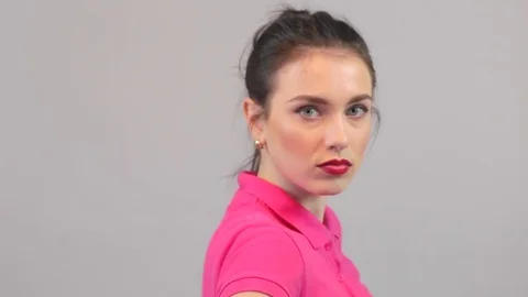 Model turns her face to the camera with serious mood. Beautiful young woman Stock Footage 73591805