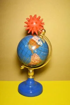 Model of the virus on the globe. Vertically, the concept of virus protection. Stock Photos