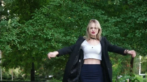 Model walking on  street and posing, slow motion Stock Footage 79991331