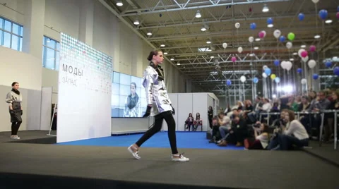 Model walks along the catwalk Stock Footage 64018330