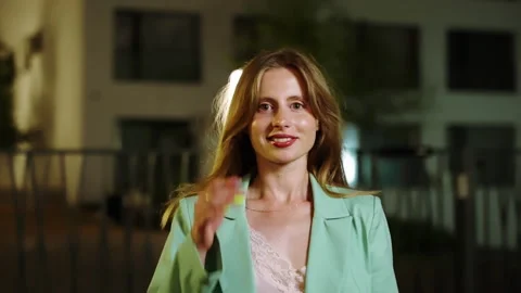 The model walks towards the camera and poses against the background of a Stock Footage 252873143