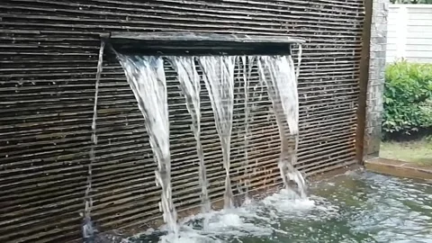 Model waterfall in the garden in front of the house 스톡 동영상 157363734