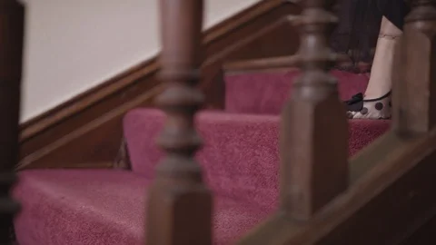 Model wearing heels going down the stairs Stock Footage 109488446