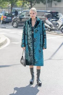 Model wears an emerald green sequin overcoat Stock Photos