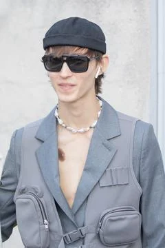 Model wears a gray jacket and a pearl necklace Stock Photos