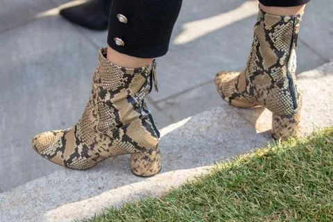 Model wears a pair of python boots Stock Photos