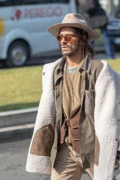 Model wears a wool jacket and a hat with brim Stock Photos