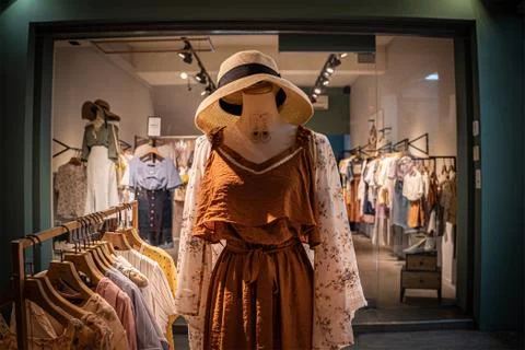 A model without head wearing new dress and a hat at a dress store in Tainan. Stock Photos