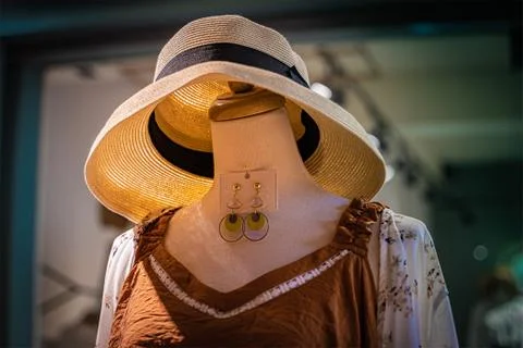 A model without head wearing new dress and a hat at a dress store in Tainan. Stock Photos