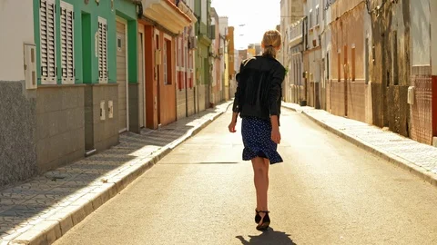 Model wlaking alone in an empty street Stock Footage 107012127