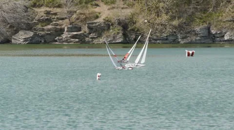 Model yachts competing in the pond Stock Footage 19718760