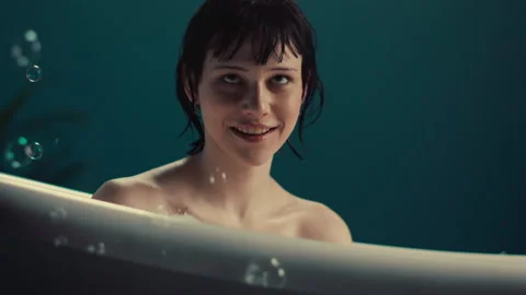 Model Young with Bangs in a Bathtub Stock Footage 275500876