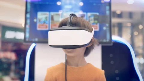 Model young man in glasses of virtual reality on dark background.. Augmented Stock Footage 128249660