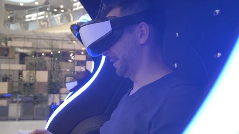 Model young man in glasses of virtual reality on dark background.. Augmented Video stock 128249683