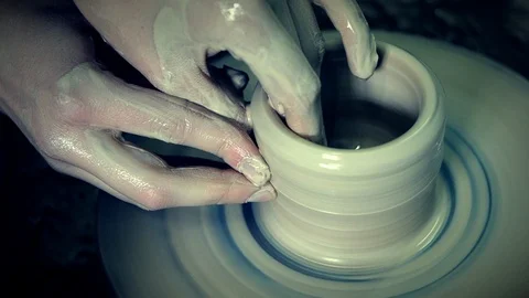 Modeling clay sculpture with hands on a rotating potter's wheel. Handmade. Stock Footage 91476682
