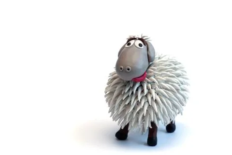 Modeling clay sheep on white background Stock Photos
