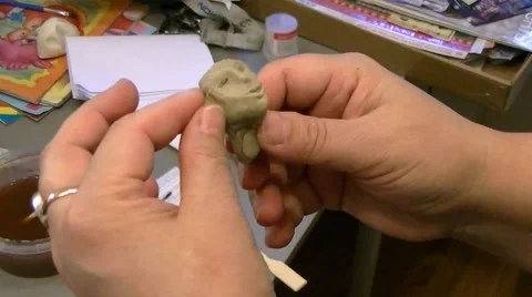 Modeling heads of plasticine Stock Footage 62475058