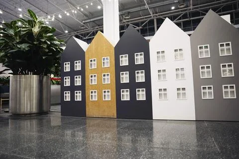 Models of colored houses lined up in a row, housing concept, mortgage Foto stock