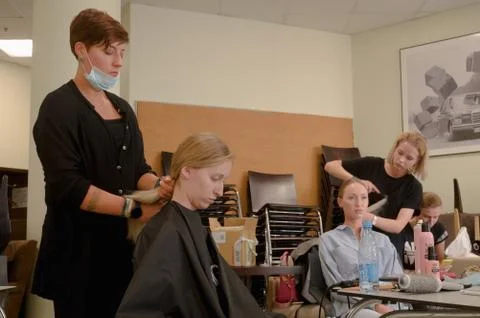 Models do a make-up and hairstyle before start the SEMILETOVA fashion show. Stock Photos
