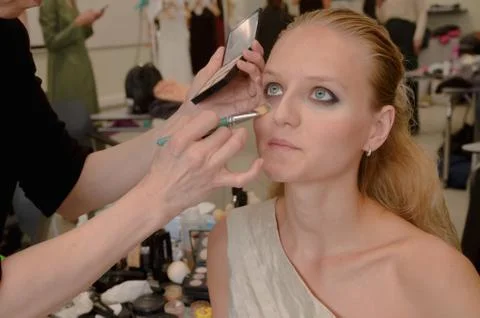 Models do a make-up and hairstyle before start the SEMILETOVA fashion show. Stock Photos