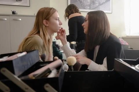 Models do a make-up and hairstyle before start the SEMILETOVA fashion show. Stock Photos