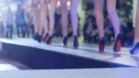 Models in lingerie and black shoes walking along podium on fashion show Stock Footage
