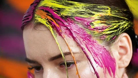 Models make a hairdo with paint Stock Footage 77138207