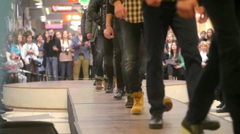 Models parade down catwalk podium - the audience watching a fashion show Stock-Footage 56730700