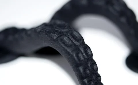 Models printed on 3D printer. Black objects printed on 3D printer made plastic Stock Photos