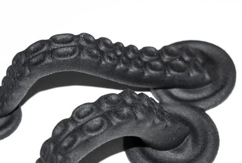 Models printed on 3D printer. Black objects printed on 3D printer made plastic Stock Photos
