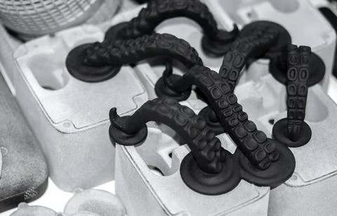Models printed on 3D printer. Black objects printed on 3D printer made plastic Foto stock