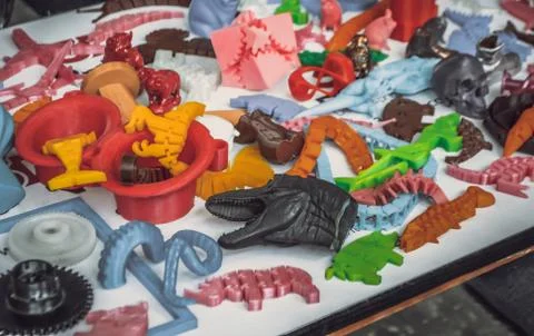 Models printed by 3d printer. Bright colorful objects printed on Stock Photos
