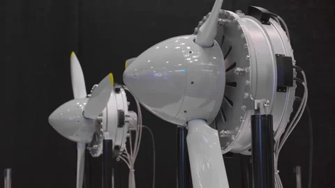 Models of two aircraft engines with rotating blades indoors. Stock Footage 249083575