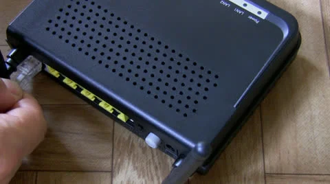 Modem, cable plugging top view Stock Footage 27092771