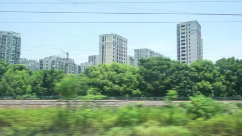 Moder cityscape through window of high speed train Stock Footage 194603603