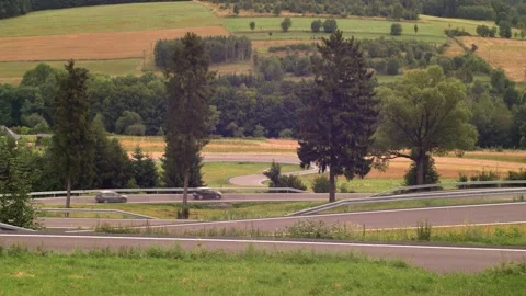 Moderate Car Traffic on Winding Switchback Road in Mountains Stock Footage 250532716