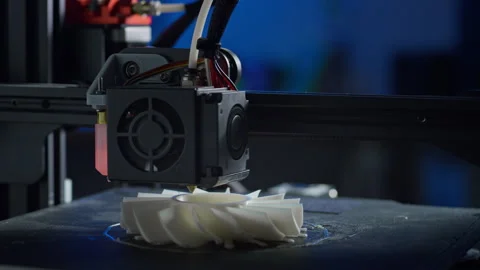 Modern 3D printer in action producing a plastic prototype in a workspace Stock Footage 329891174