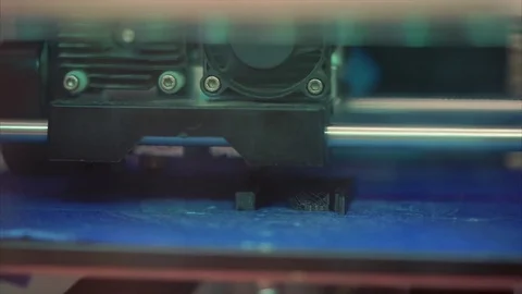 Modern 3D printer applying ABS plastic on surface and printing figure Stock Footage 79101558
