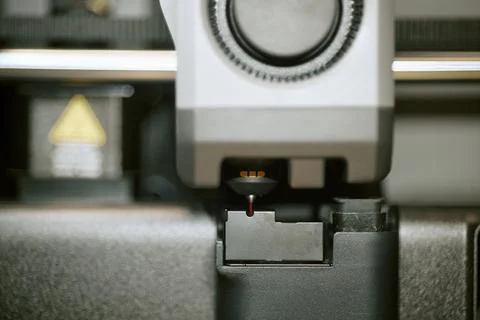 Modern 3d Printer Extruder Nozzle Extruding Filament in Workshop Stock Photos