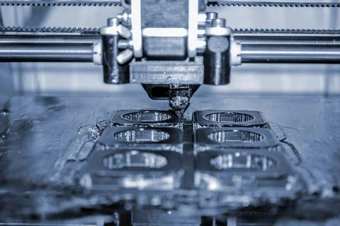 Modern 3D printer printing figure close-up. Automatic three dimensional Stock Photos