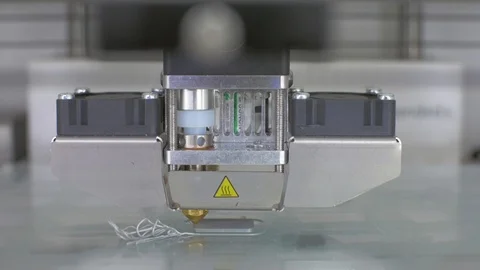 Modern 3D printer printing an object from the hot molten Stock Footage