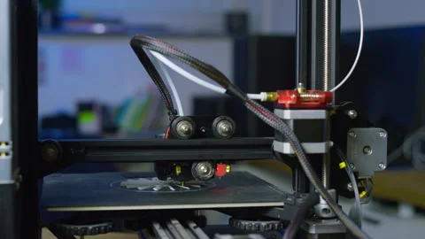 Modern 3D printer producing a plastic prototype in a clean workspace setting Stock Footage 329888814