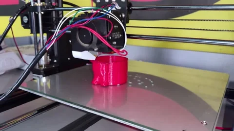 A modern 3D printer at work. Macro photography of a CNC machine that independent Stock Footage 140012013