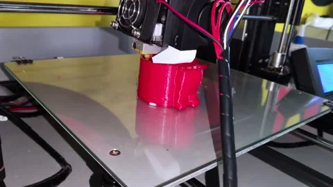 A modern 3D printer at work. Macro photography of a CNC machine that independent Stock Footage 140012043