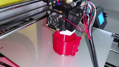 A modern 3D printer at work. Macro photography of a CNC machine that independent Stock Footage 140012104