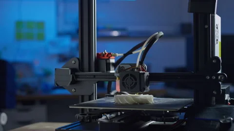 Modern 3D printer works on plastic prototype in clean tech workspace Stock Footage 329890171