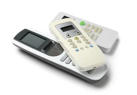 Modern air conditioner remote controls isolated on white background Stock Photos